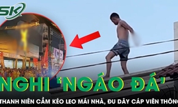 Thanh niên nghi ‘ngáo đá’ cầm kéo leo mái nhà, đu dây cáp viễn thông khiến cả khu phố náo loạn