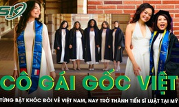 Cô gái gốc Việt mặc áo dài, mang theo lá cờ của người cha quá cố nhận bằng Tiến sĩ Luật tại Mỹ