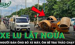 Xe lu lật ngửa giữa đường, người đàn ông bỏ xe máy ôm bé trai tháo chạy