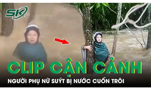 Cận cảnh khoảnh khắc người d&#226;n n&#233;m d&#226;y thừng cứu người phụ nữ bị nước cuốn tr&#244;i c&#249;ng xe m&#225;y