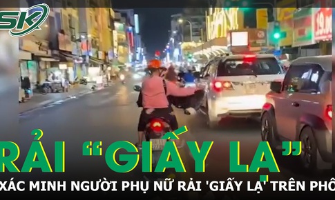Xác minh clip người phụ nữ rải 'giấy lạ' trên đường ở TP.HCM