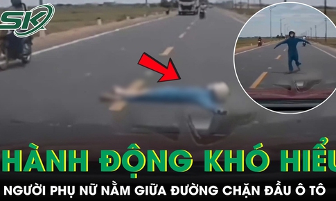 Người phụ nữ lao ra nằm giữa đường, chặn đầu ô tô gây xôn xao dư luận